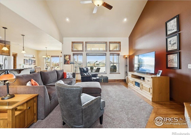 3560 Peruvian Torch Dr, Loveland, CO 80537 - living area featuring high vaulted ceiling, a ceiling fan, wood finished floors, a chandelier, and recessed lighting