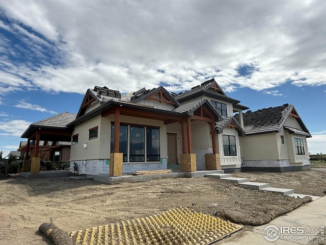 2805 Potomac Ct, Berthoud, CO 80513 - rear view of property featuring stone siding and stucco siding