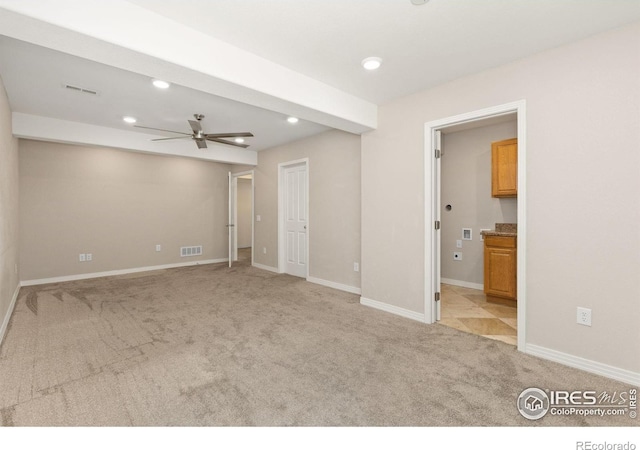 spare room with a ceiling fan, light colored carpet, recessed lighting, and visible vents