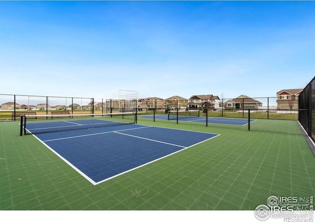 view of sport court featuring fence and community basketball court