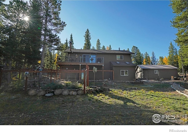 10649 Christopher Dr, Conifer, CO 80433 - rear view of house featuring fence and a balcony