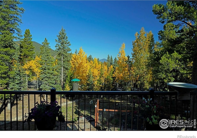 10649 Christopher Dr, Conifer, CO 80433 - balcony featuring a view of trees