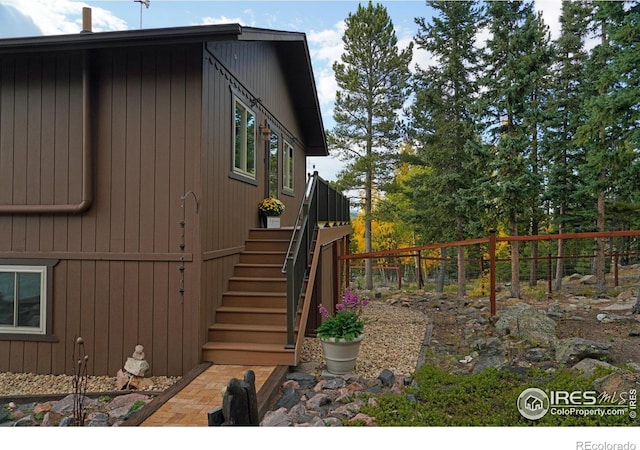 10649 Christopher Dr, Conifer, CO 80433 - view of side of home featuring fence and stairs