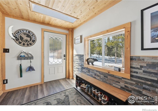 10649 Christopher Dr, Conifer, CO 80433 - entryway with wood ceiling, baseboards, wood finished floors, and a skylight