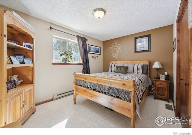 10649 Christopher Dr, Conifer, CO 80433 - bedroom with a baseboard heating unit, a textured ceiling, baseboards, and light carpet