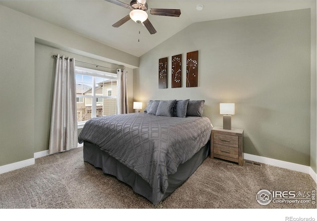 carpeted bedroom with lofted ceiling, baseboards, and ceiling fan