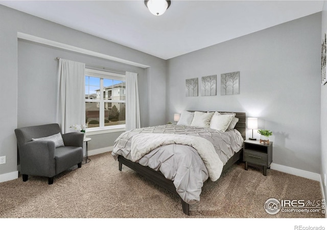 carpeted bedroom with baseboards