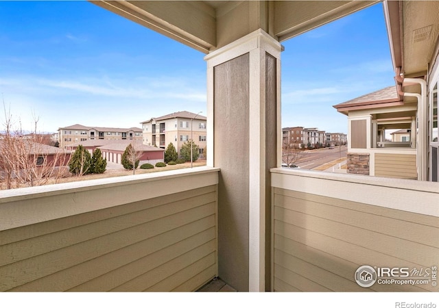 balcony featuring a residential view