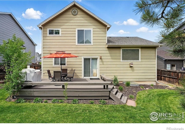 4774 Coker Ave, Castle Rock, CO 80104 - back of property with a wooden deck, outdoor dining area, and a shingled roof
