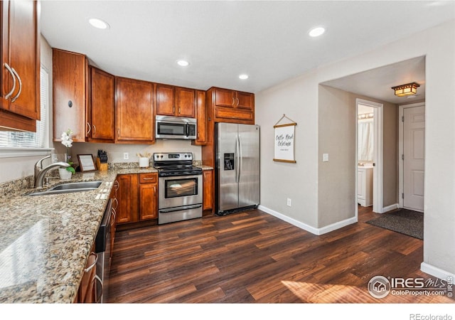 4774 Coker Ave, Castle Rock, CO 80104 - kitchen with stainless steel appliances, a sink, dark wood finished floors, baseboards, and recessed lighting
