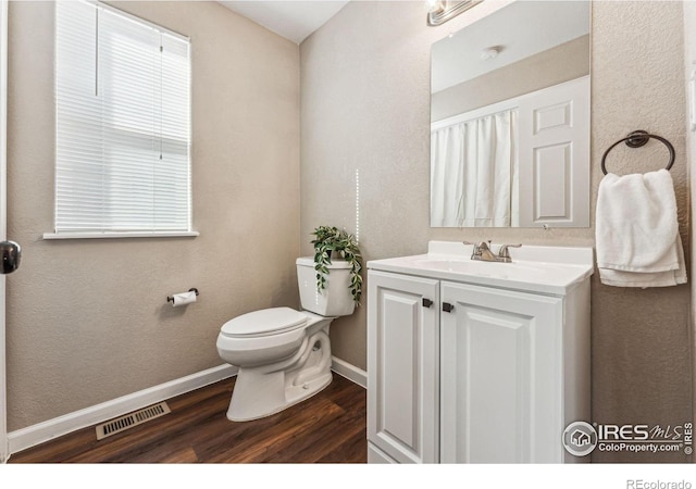 4774 Coker Ave, Castle Rock, CO 80104 - bathroom featuring wood finished floors, toilet, vanity, and baseboards