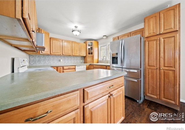 17492 County Road 29, Brush, CO 80723 - kitchen with dark wood finished floors, backsplash, white appliances, a peninsula, and glass insert cabinets