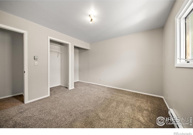 17492 County Road 29, Brush, CO 80723 - unfurnished bedroom with two closets, carpet floors, and baseboards