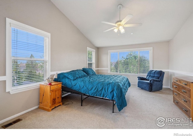 carpeted bedroom with baseboards, a ceiling fan, lofted ceiling, and visible vents