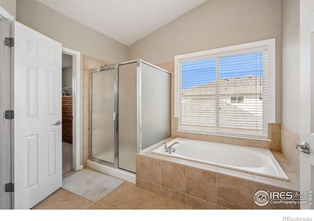 11676 Montgomery Cir, Longmont, CO 80504 - full bath featuring a shower stall, a garden tub, a walk in closet, and tile patterned flooring