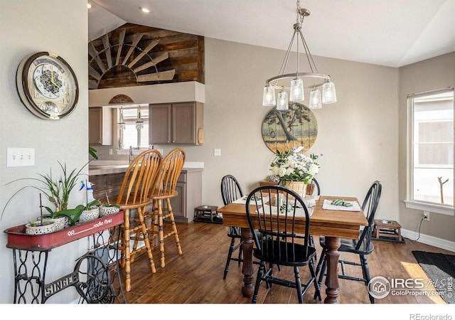 2190 Coyote Creek Dr, Fort Lupton, CO 80621 - dining space featuring vaulted ceiling, dark wood finished floors, and baseboards