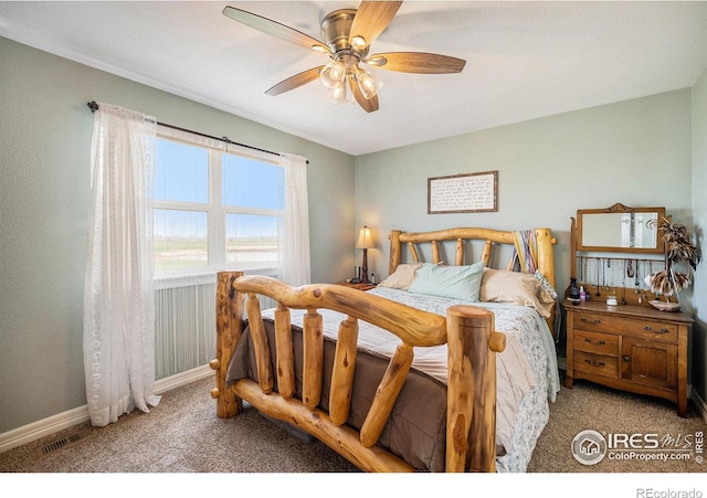 2190 Coyote Creek Dr, Fort Lupton, CO 80621 - carpeted bedroom with baseboards and a ceiling fan