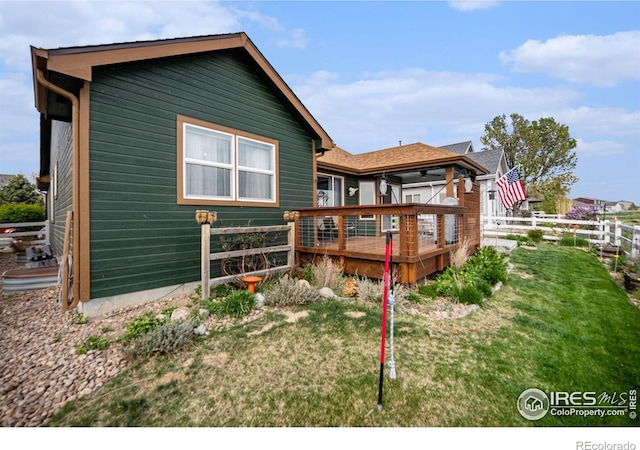 2190 Coyote Creek Dr, Fort Lupton, CO 80621 - back of property with a wooden deck