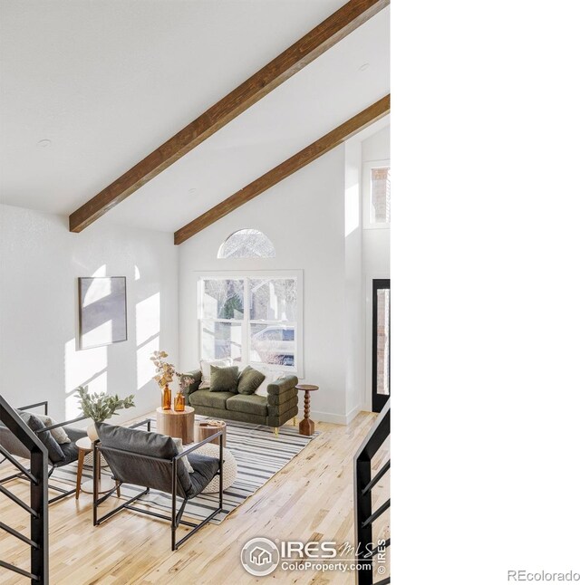 1012 Hobson Ct, Fort Collins, CO 80526 - living room featuring beamed ceiling, light wood-style floors, and high vaulted ceiling