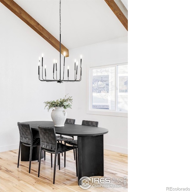 1012 Hobson Ct, Fort Collins, CO 80526 - dining area with a chandelier, wood finished floors, and baseboards