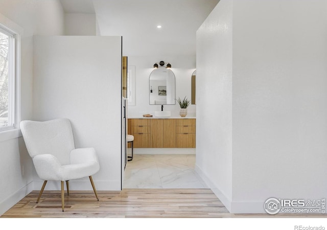 1012 Hobson Ct, Fort Collins, CO 80526 - living area featuring light marble finish flooring, baseboards, and recessed lighting