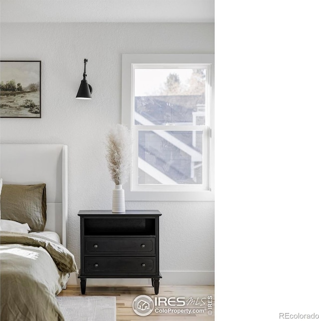 1012 Hobson Ct, Fort Collins, CO 80526 - bedroom featuring wood finished floors and baseboards