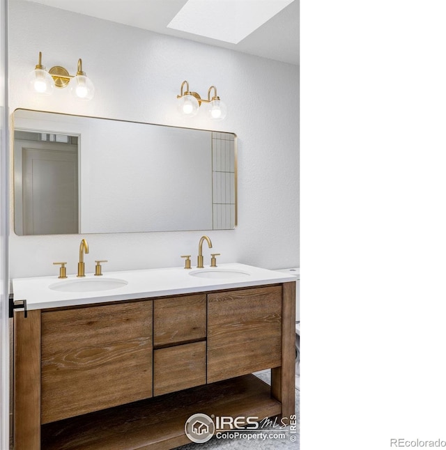 1012 Hobson Ct, Fort Collins, CO 80526 - bathroom with a skylight and double vanity