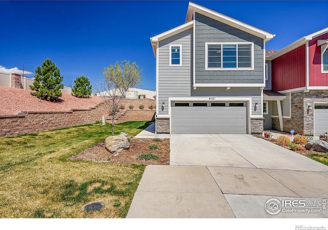 view of front of home featuring concrete driveway, stone siding, a front yard, and a garage