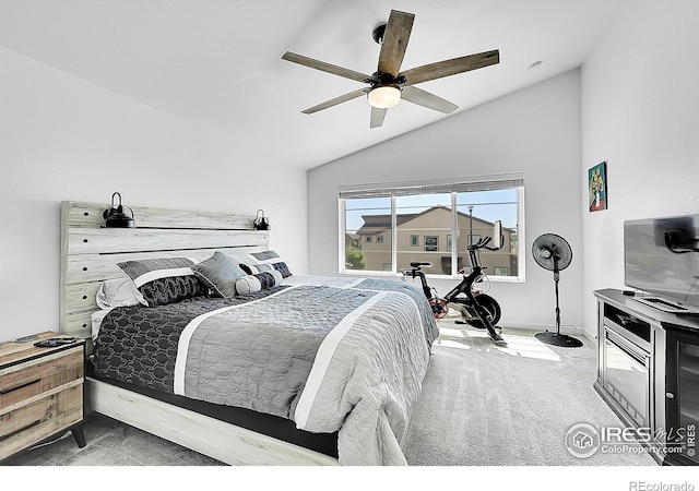 carpeted bedroom featuring vaulted ceiling and ceiling fan