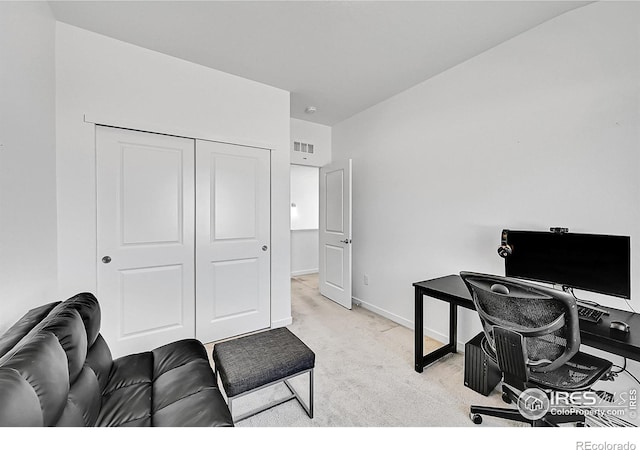 home office with baseboards, visible vents, and light colored carpet