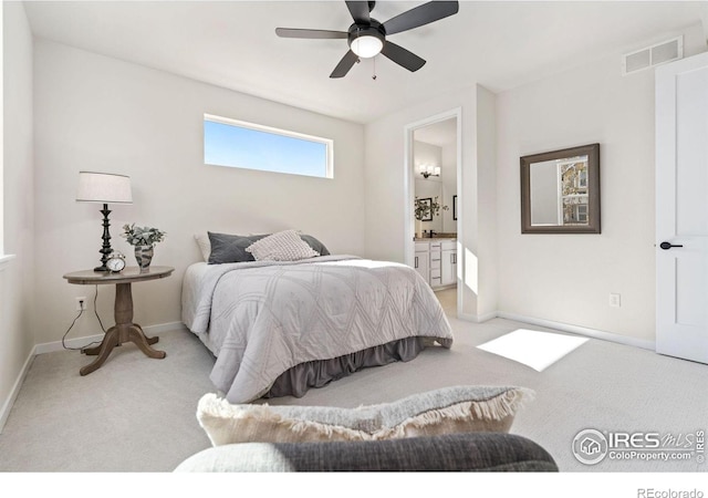 bedroom featuring baseboards, visible vents, a ceiling fan, carpet floors, and connected bathroom