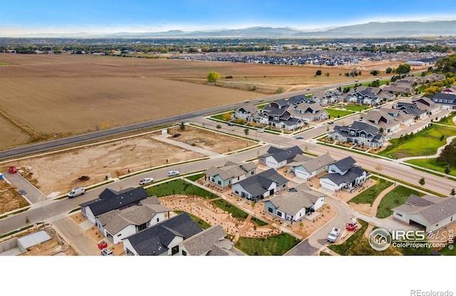 birds eye view of property featuring a mountain view and a residential view