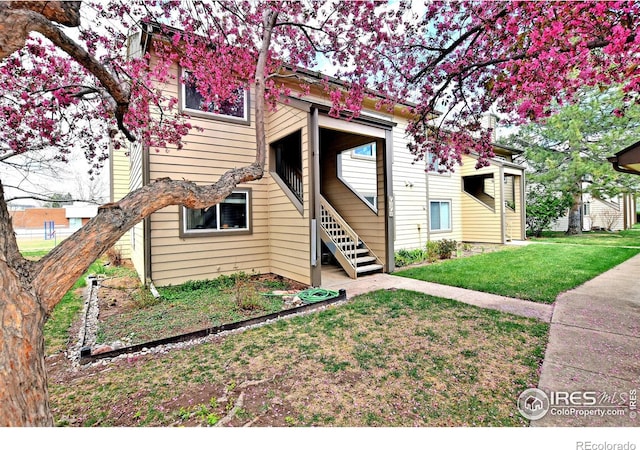 3465 Lochwood Dr Unit G-32, Fort Collins, CO 80525 - view of front of property featuring a front lawn and stairway