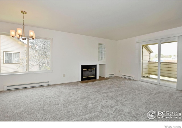 3465 Lochwood Dr Unit G-32, Fort Collins, CO 80525 - unfurnished living room with a baseboard heating unit, carpet floors, a notable chandelier, and a fireplace with flush hearth