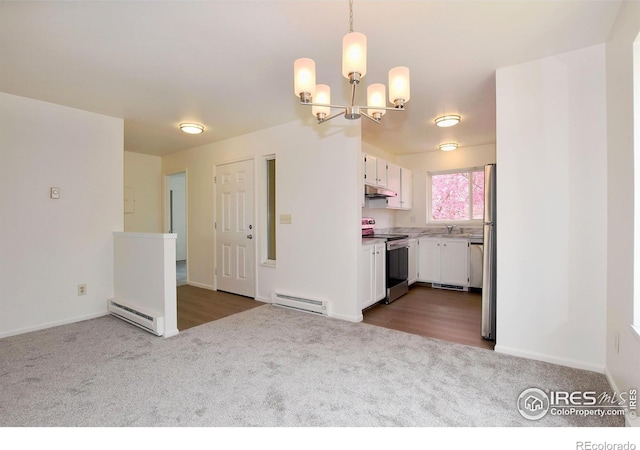 3465 Lochwood Dr Unit G-32, Fort Collins, CO 80525 - kitchen with a chandelier, carpet flooring, stainless steel electric range oven, and baseboard heating