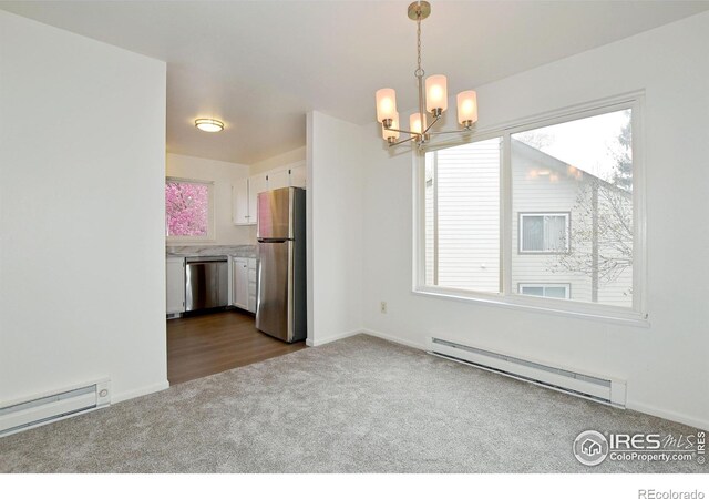 3465 Lochwood Dr Unit G-32, Fort Collins, CO 80525 - unfurnished dining area with a baseboard heating unit, a chandelier, dark colored carpet, and a healthy amount of sunlight