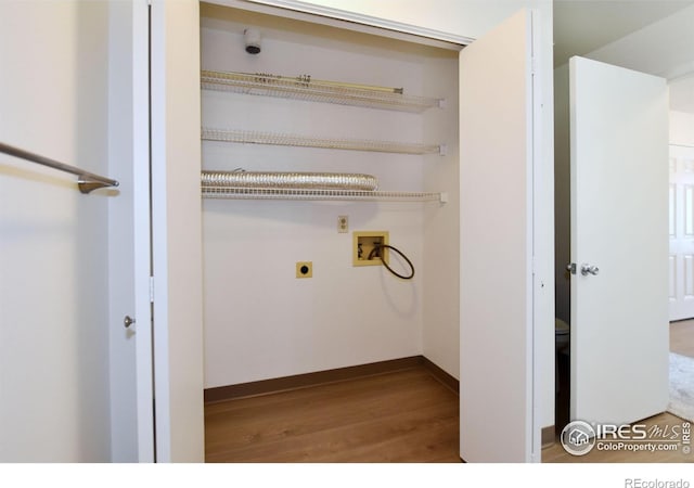 3465 Lochwood Dr Unit G-32, Fort Collins, CO 80525 - clothes washing area with baseboards, washer hookup, wood finished floors, electric dryer hookup, and laundry area