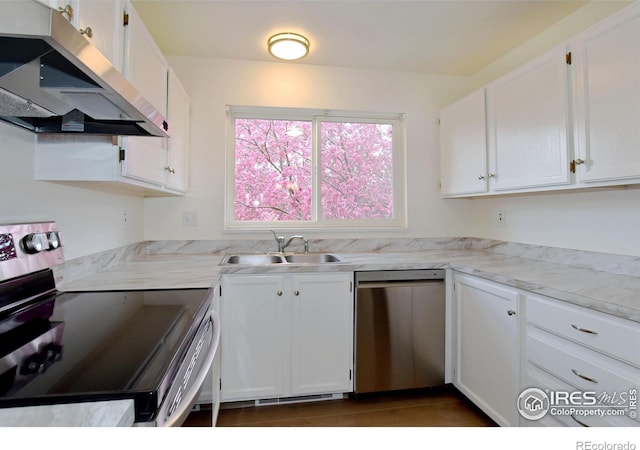 3465 Lochwood Dr Unit G-32, Fort Collins, CO 80525 - kitchen featuring white cabinets, a sink, range hood, and appliances with stainless steel finishes