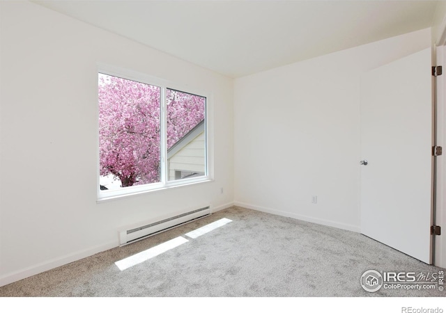 3465 Lochwood Dr Unit G-32, Fort Collins, CO 80525 - empty room with baseboard heating, baseboards, and carpet flooring