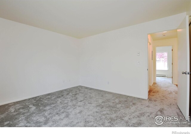 3465 Lochwood Dr Unit G-32, Fort Collins, CO 80525 - carpeted empty room featuring baseboard heating and baseboards