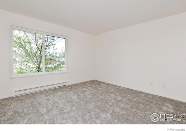 3465 Lochwood Dr Unit G-32, Fort Collins, CO 80525 - empty room featuring baseboards, carpet, and a baseboard radiator