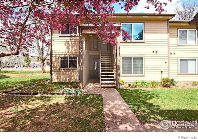 3465 Lochwood Dr Unit G-32, Fort Collins, CO 80525 - view of property with a front lawn and stairway