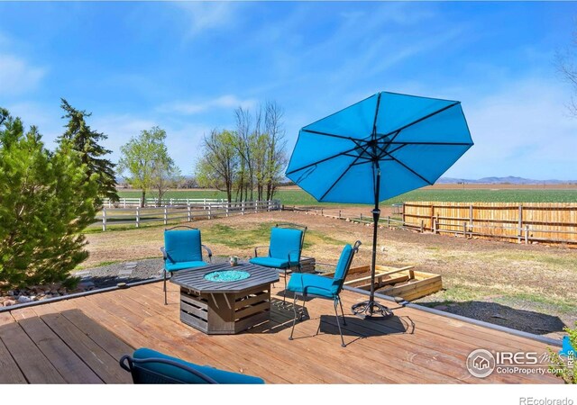 7859 Whitetail Cir, Wellington, CO 80549 - wooden deck featuring a fire pit