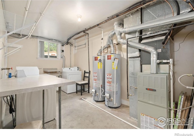 basement featuring water heater and independent washer and dryer