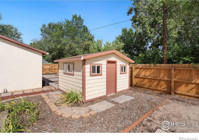 view of shed featuring a fenced backyard