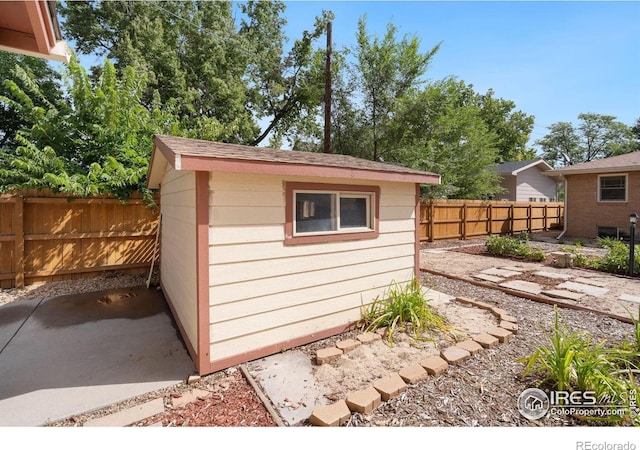 view of shed featuring a fenced backyard