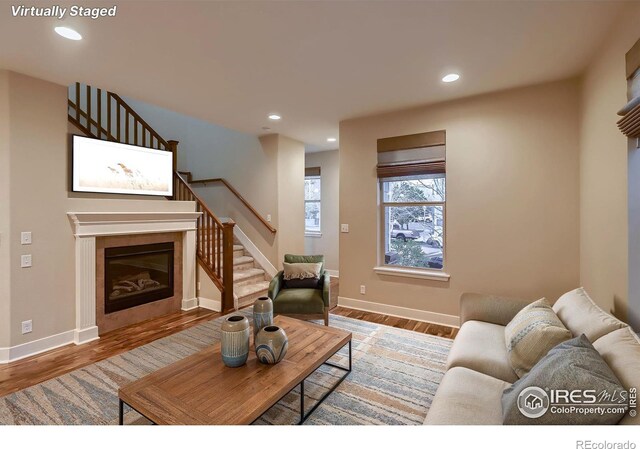 8482 Parkland St, Broomfield, CO 80021 - living area with stairway, recessed lighting, baseboards, and wood finished floors