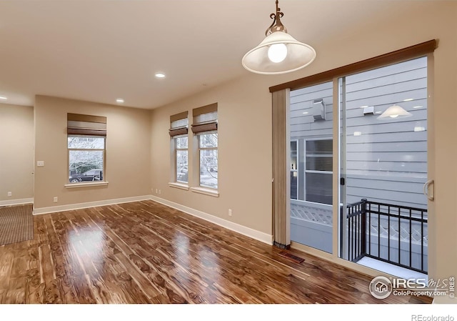 8482 Parkland St, Broomfield, CO 80021 - empty room featuring wood finished floors, baseboards, and recessed lighting