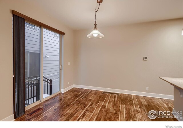 8482 Parkland St, Broomfield, CO 80021 - unfurnished room featuring baseboards and wood finished floors