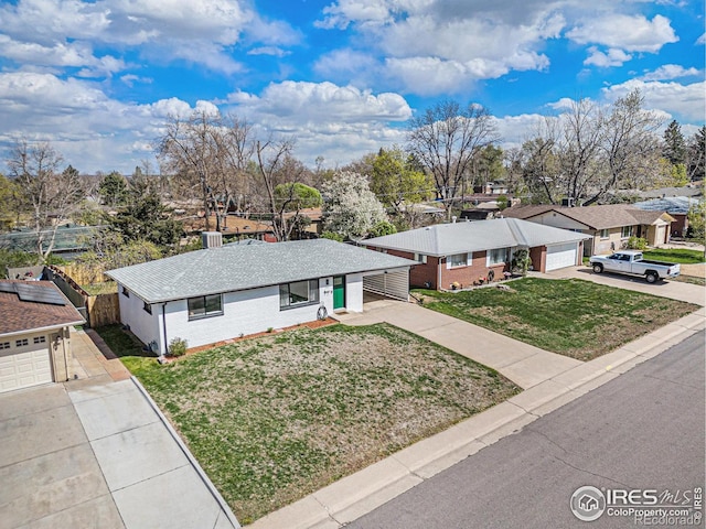 2566 S Stuart St, Denver, CO 80219 - view of front of property with concrete driveway, a residential view, and brick siding